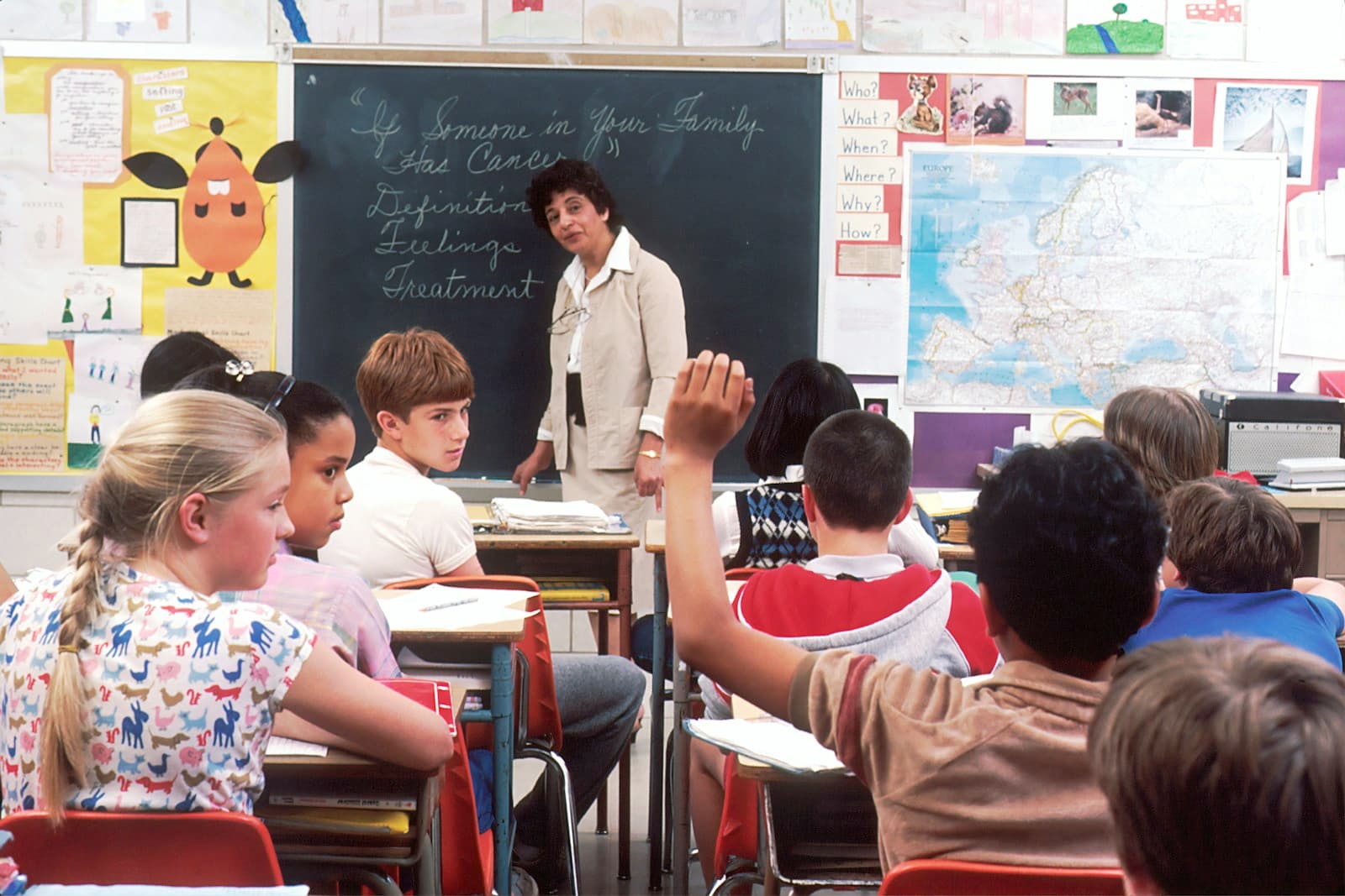 Kids working in a bright classroom
